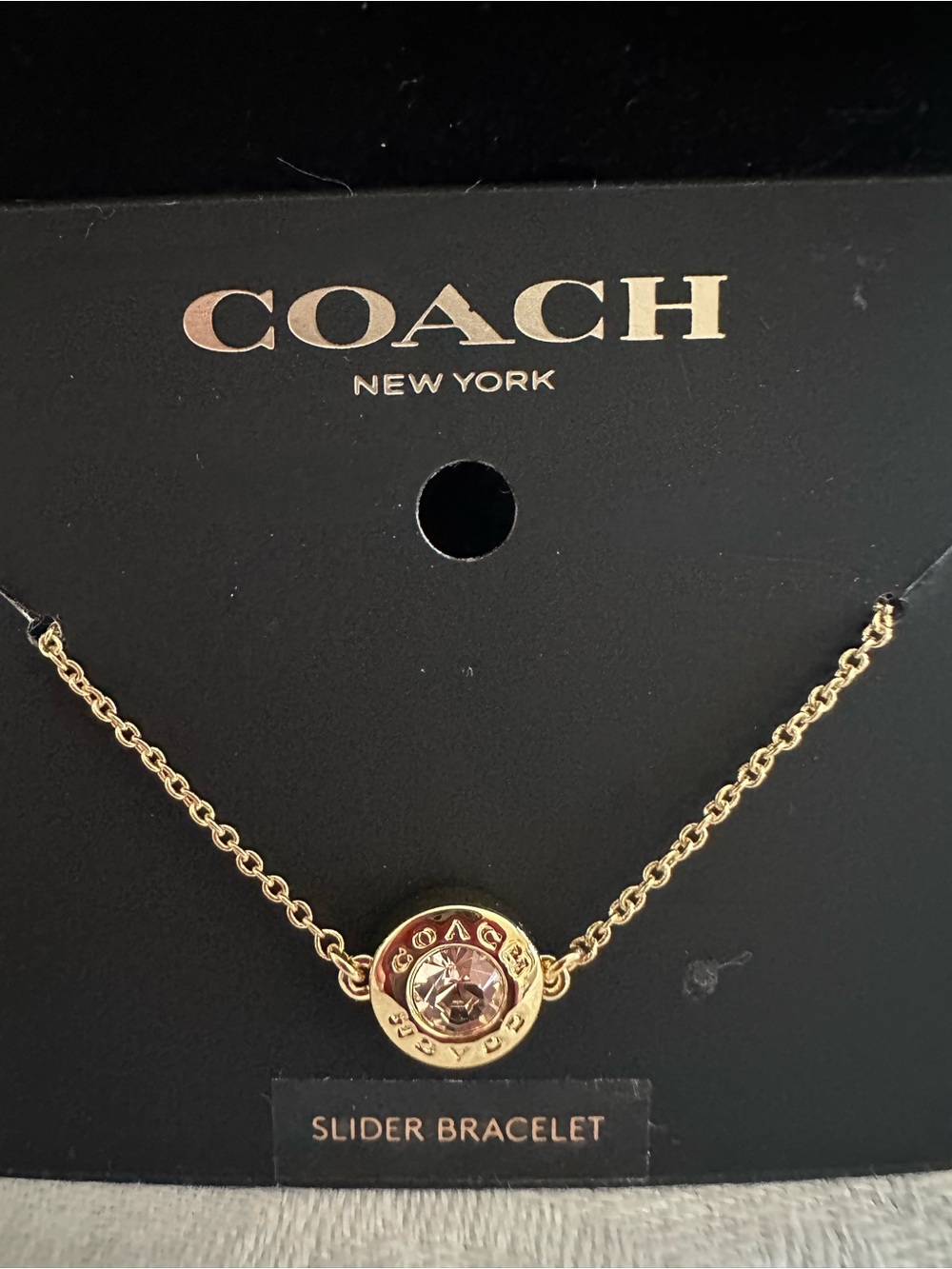Coach Gold-Tone Bracelet with Light Pink Crystal